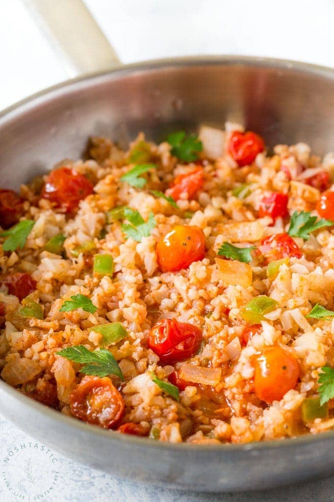 Cauliflower Mexican Rice, a low carb spin on a classic recipe, also known as Spanish Cauliflower Rice, easy paleo, low carb, whole30 side dish recipe you’ll love! | www.noshtastic.com | #lowcarb #keto #paleo #cauliflowerrice #mexicanrice #spanishrice #whole30 #w30 #glutenfree #noshtastic #glutenfreerecipe 