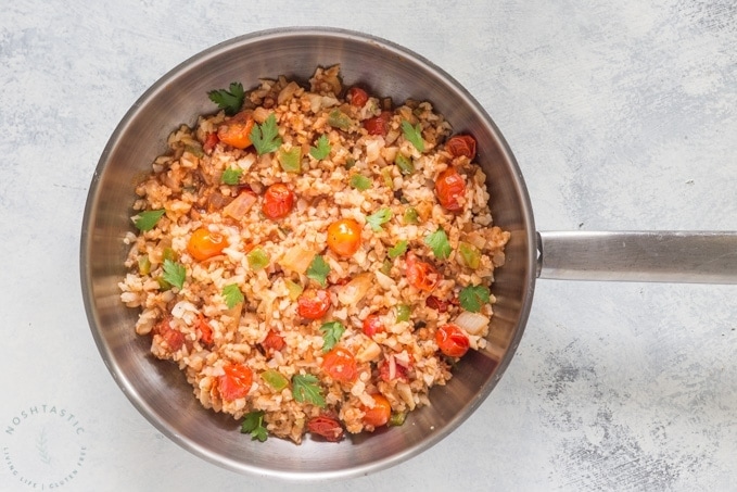 Cauliflower Mexican Rice, a low carb spin on a classic recipe, also known as Spanish Cauliflower Rice, easy paleo, low carb, whole30 side dish recipe you’ll love! | www.noshtastic.com | #lowcarb #keto #paleo #cauliflowerrice #mexicanrice #spanishrice #whole30 #w30 #glutenfree #noshtastic #glutenfreerecipe
