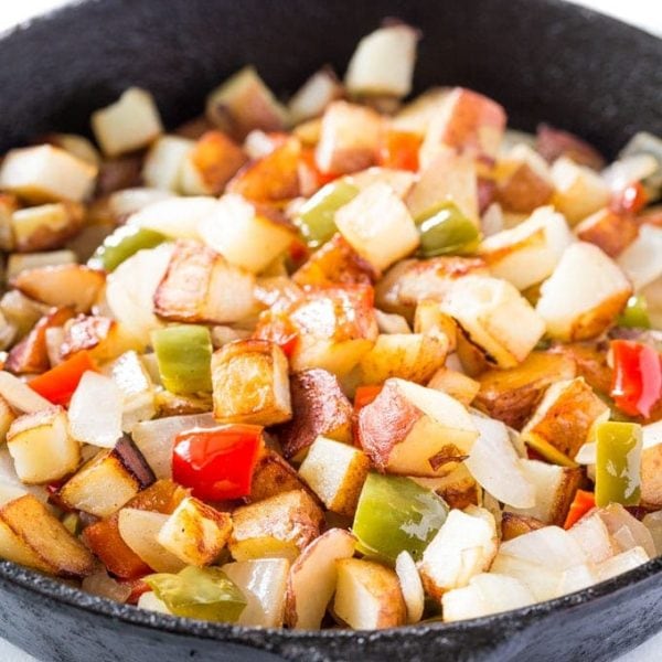 Potatoes O Brien Recipe in a skillet with bell peppers and onions