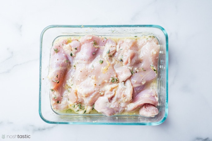 chicken marinating for making mediterranean chicken salad 