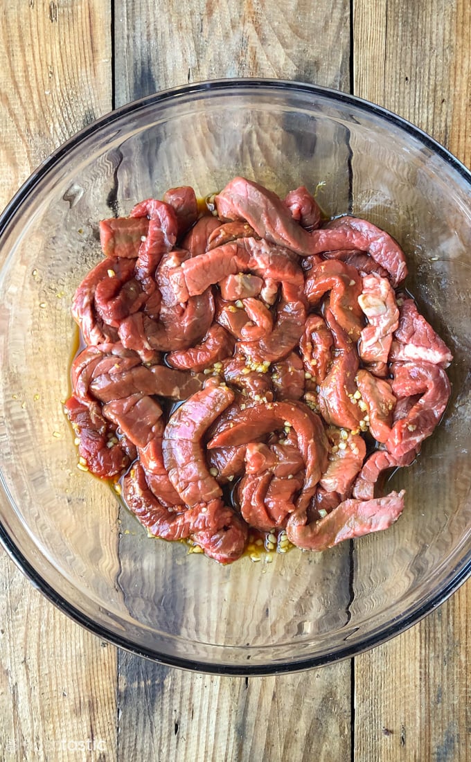 marinating meat in a bowl