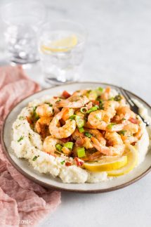 Keto Shrimp and Grits recipe that is just PERFECTION on a plate, it doesn't get any better than this!! With cheesy, yummy, grain free 'grits' you'll be coming back for more!! This keto low carb shrimp recipe comes together in next to no time and is a really easy weeknight family meal that can double as a fancy dinner party menu item too, you're going to LOVE it! | www.noshtastic.com | #lowcarb #noshtastic #glutenfree #keto #shrimp #grits #shrimpandgrits #ketodiet #ketogenic #ketorecipes #ketogenicdiet #cheese #cheddar #whitecheddar