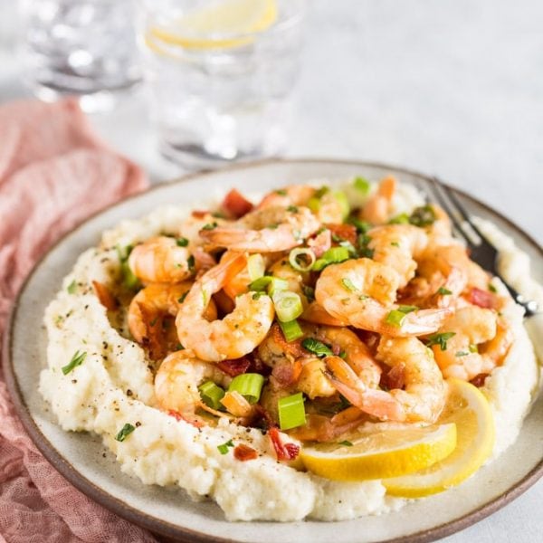 Keto Shrimp and Grits recipe that is just PERFECTION on a plate, it doesn't get any better than this!! With cheesy, yummy, grain free 'grits' you'll be coming back for more!! This keto low carb shrimp recipe comes together in next to no time and is a really easy weeknight family meal that can double as a fancy dinner party menu item too, you're going to LOVE it! | www.noshtastic.com | #lowcarb #noshtastic #glutenfree #keto #shrimp #grits #shrimpandgrits #ketodiet #ketogenic #ketorecipes #ketogenicdiet #cheese #cheddar #whitecheddar