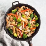 Easy Low Carb Chicken Stir Fry Recipe, quick, delicious, you'll LOVE this Keto Chicken Stir Fry recipe and so will your kids! Made with Chicken, low carb stir fry sauce, broccoli, red bell peppers, mushrooms, and onions. This recipe is gluten free, paleo, whole30, low carb, and keto friendly. #lowcarb #keto #paleo #w30 #easy #quick #chicken #stirfry #easydinner #chickendinner #lowcarbstirfry #chickenstirfry #ketostirfry #ketodiet #ketogenicdiet #noshtastic #glutenfree
