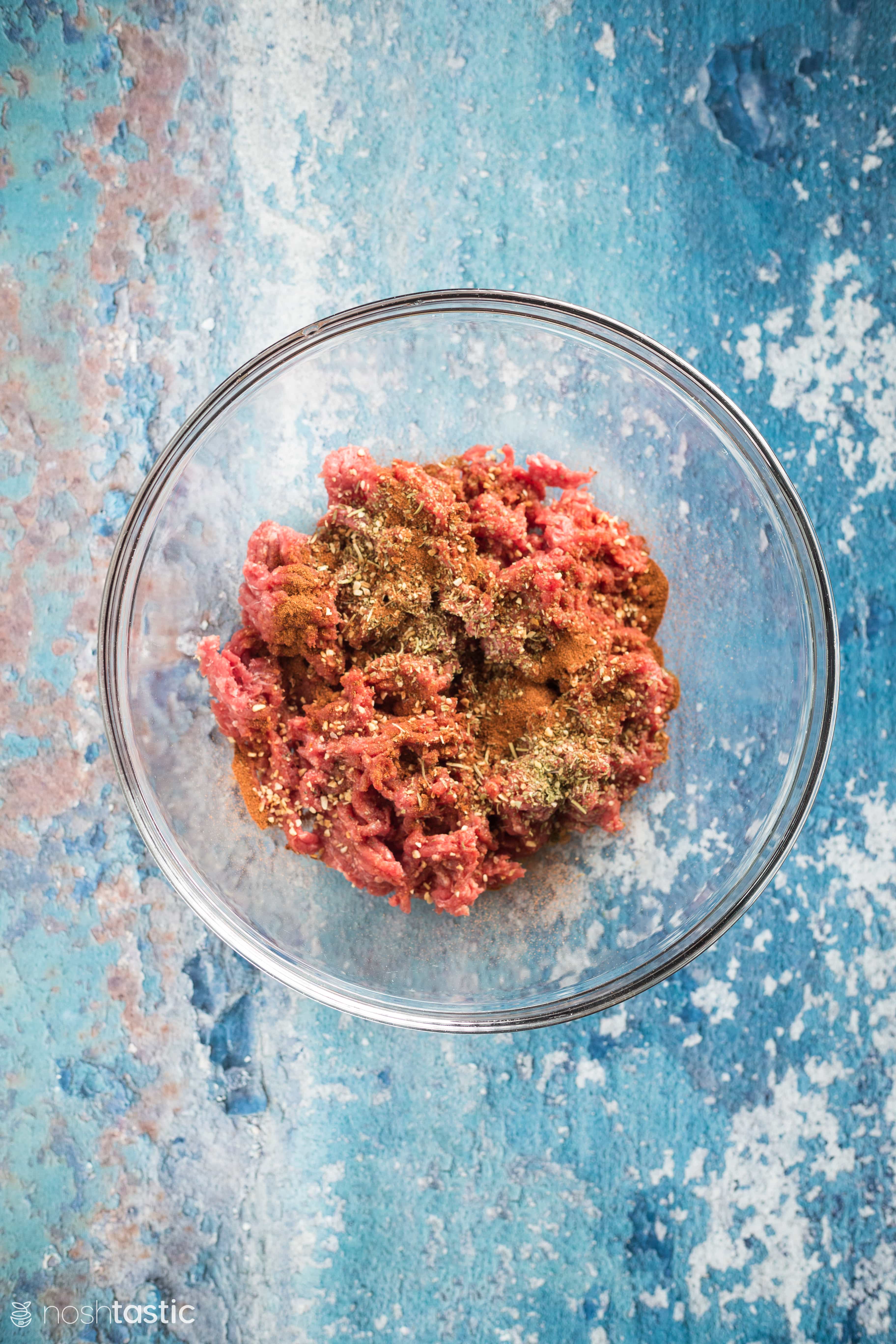 ground beef with herbs in a bowl