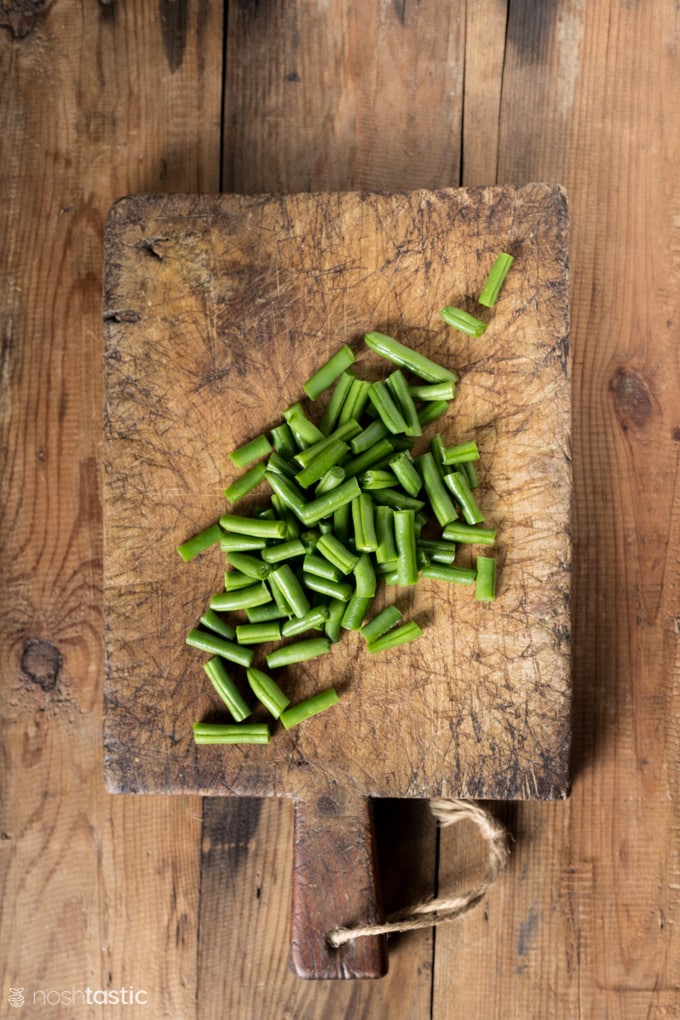 green beans on a cutting board 