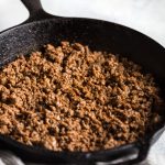 Taco meat cooked in cast iron skillet