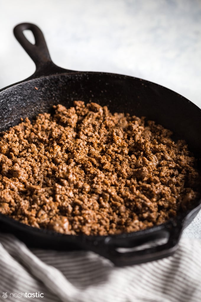 Taco meat cooked in cast iron skillet