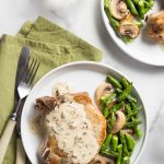 Keto Pork Chops on a plate with asparagus