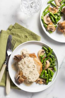 Keto Pork Chops on a plate with asparagus