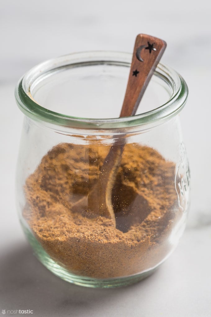 Ras El Hanout spices in a small glass jar