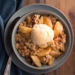 Gluten Free Apple Crisp in a bowl with scoop of ice cream