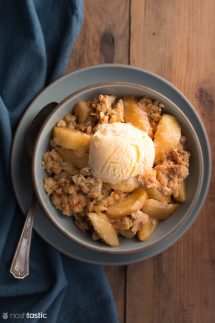 Gluten Free Apple Crisp in a bowl with scoop of ice cream