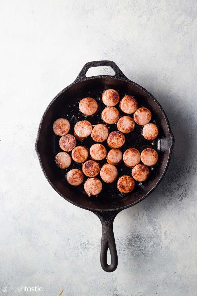 sausages for making pineapple appetizers in a skillet