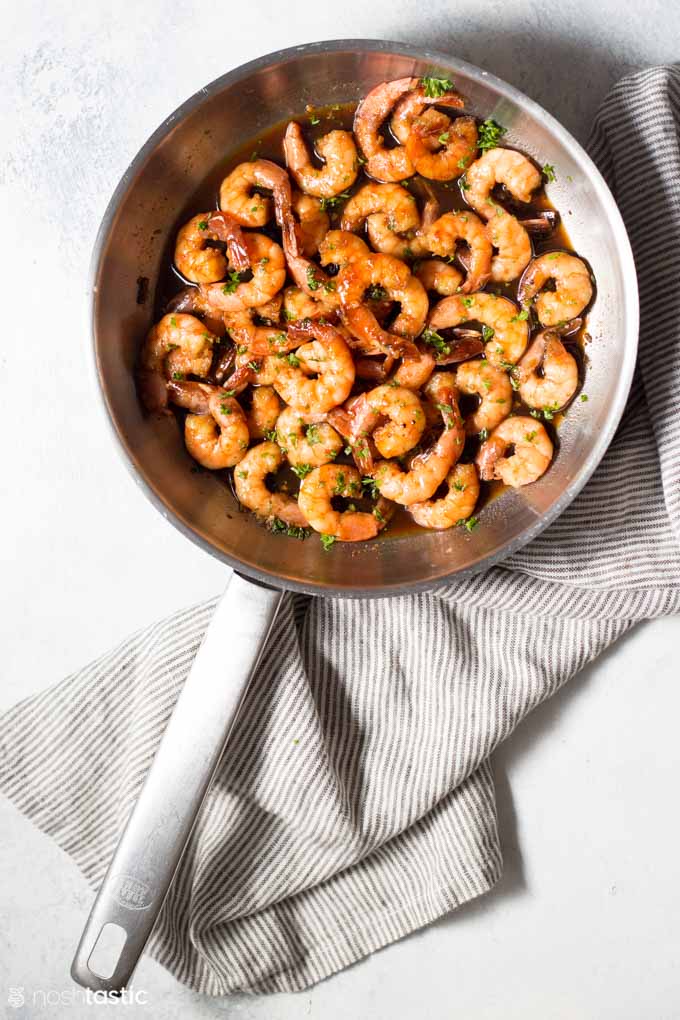 overhead image of honey garlic shrimp in a skillet