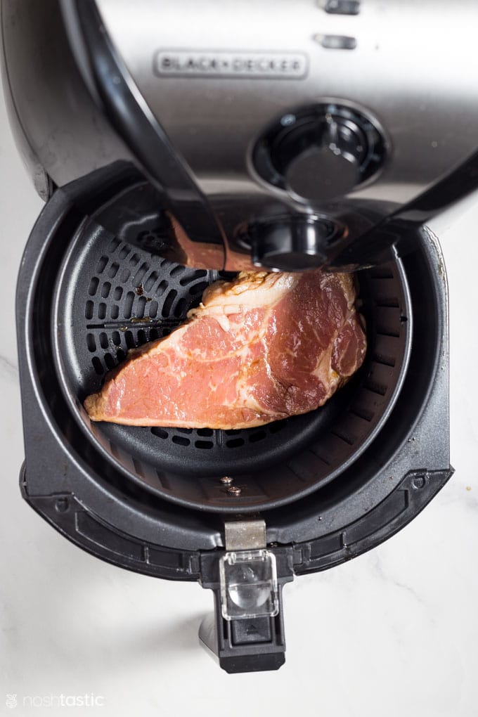 Strip steak in an air fryer basket