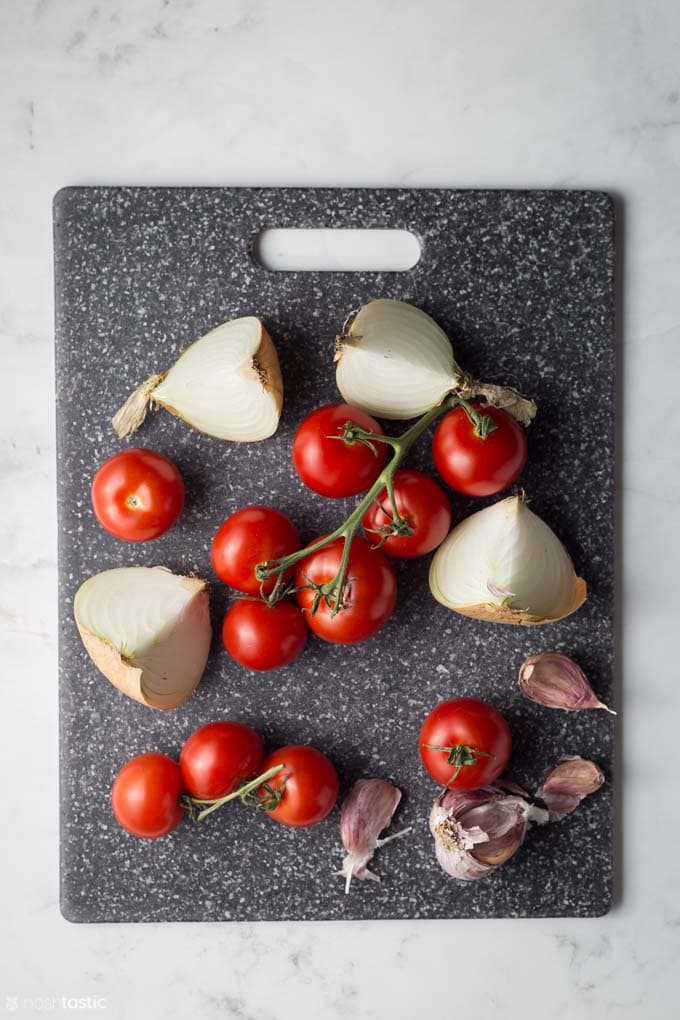 Ingredients on a board for Instant Pot tomato soup