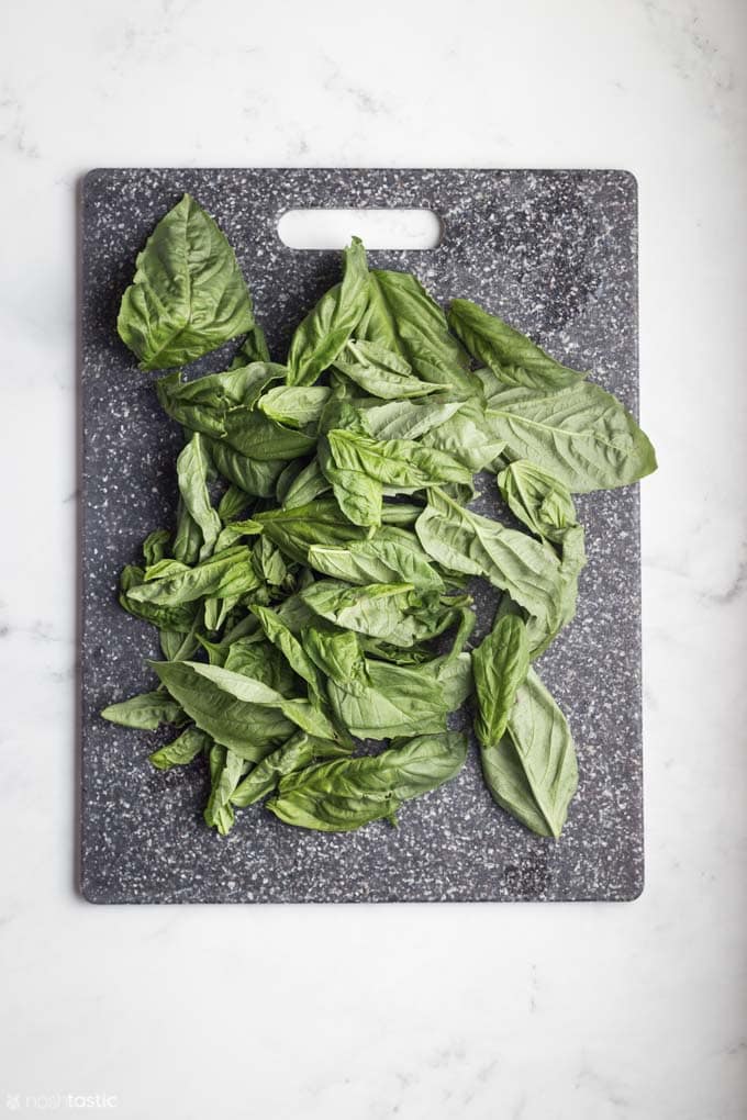 fresh basil on a cutting board