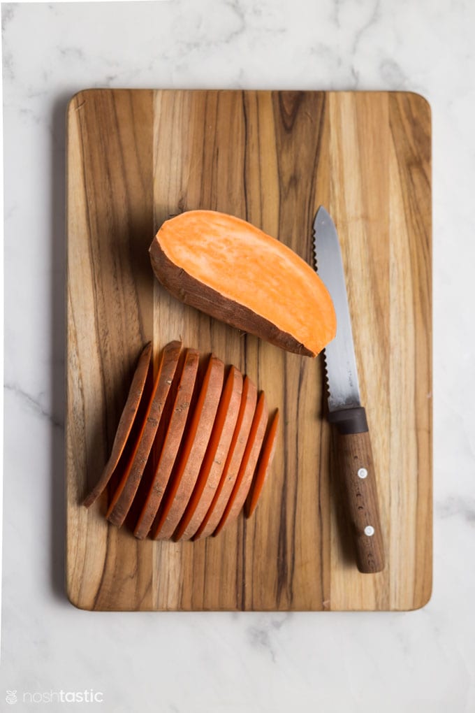 Sliced sweet potatoes on a board