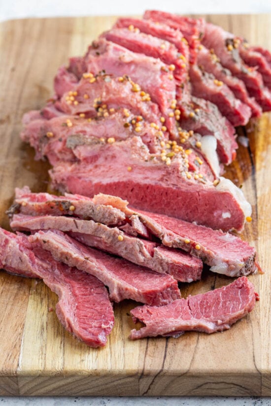 sliced corned beef on a board