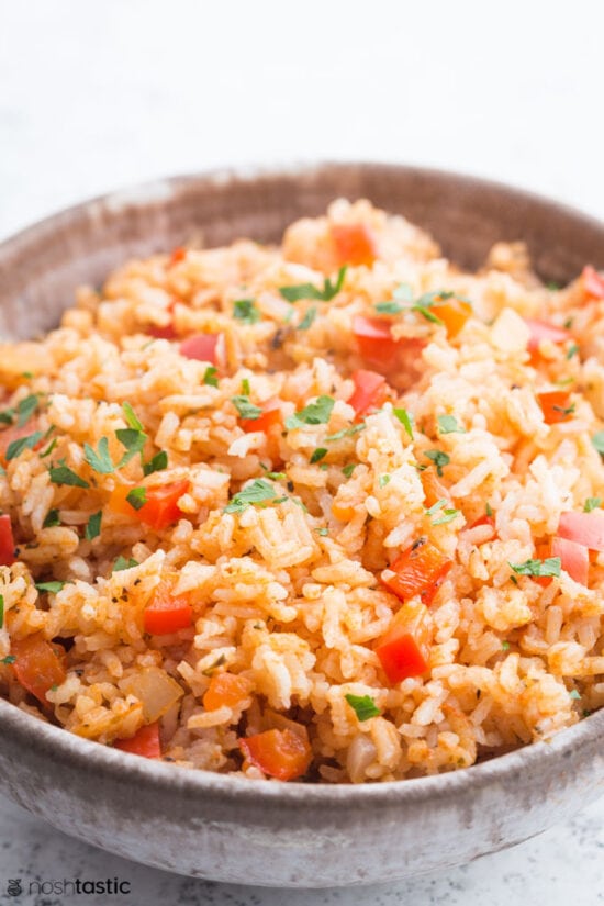 spanish rice in brown bowl