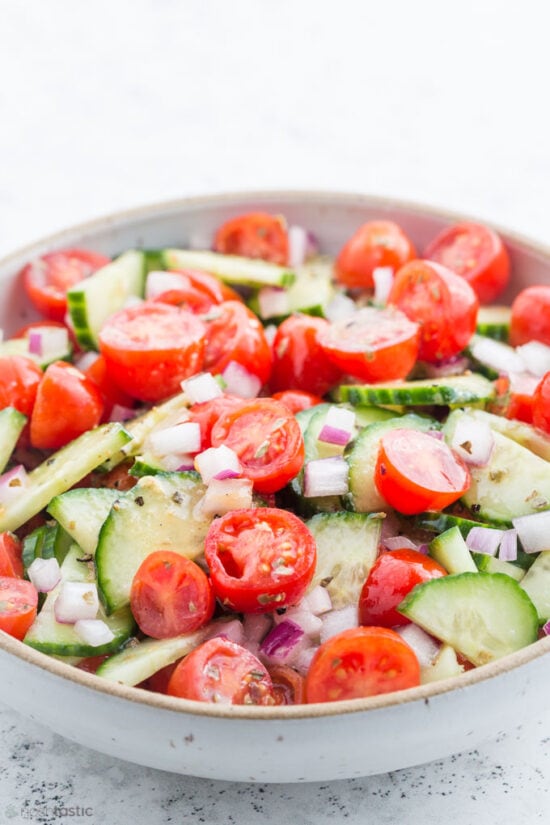 cucumber tomato salad in bowl 