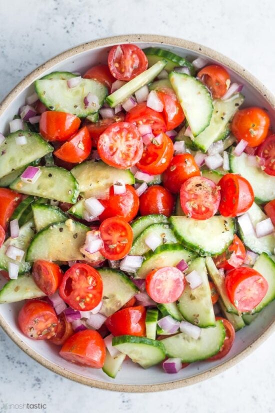 cucumber tomato salad in bowl 