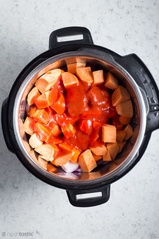 ingredients for beef stew inside a pressure cooker