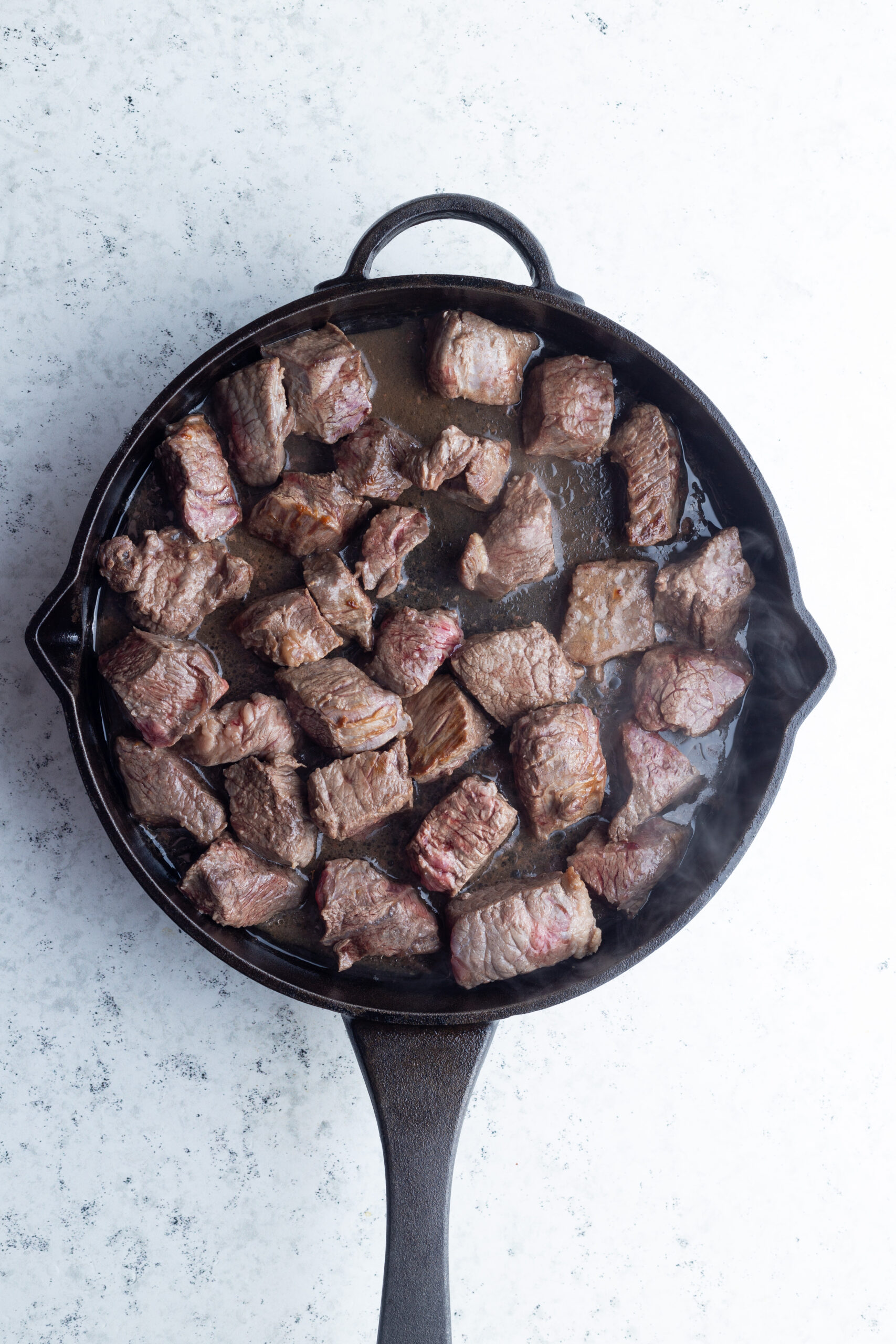 beef chunks in a skillet