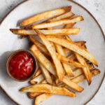 French Fries on a plate with ketchup