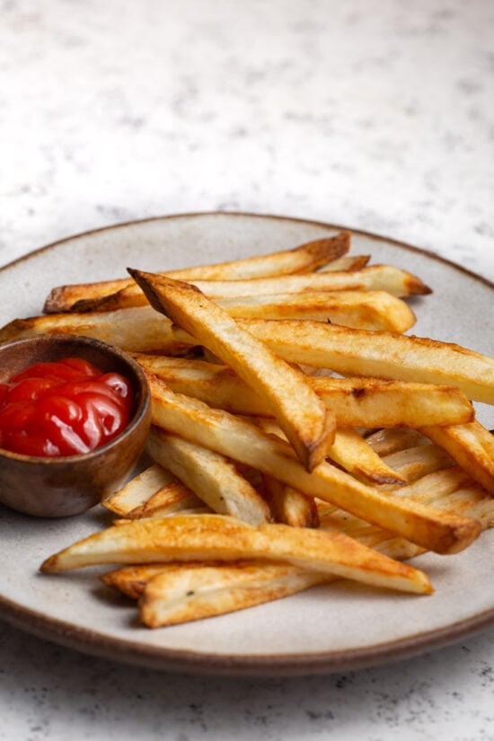 French Fries on a plate with ketchup