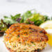 Salmon patty on a plate with salad