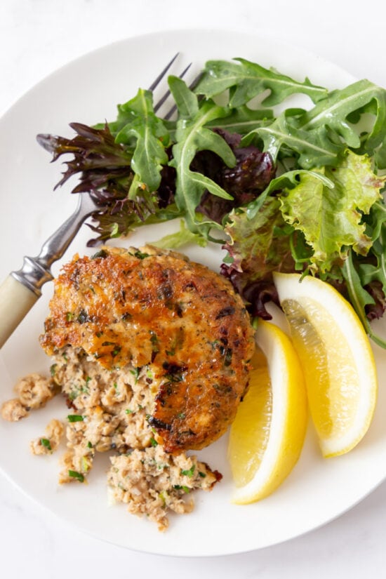 salmon fish cake with lemon and salad