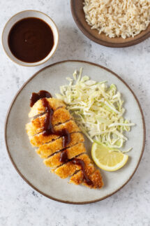 chicken katsu with shredded cabbage and lemon