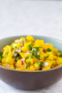 mango salsa in a brown bowl