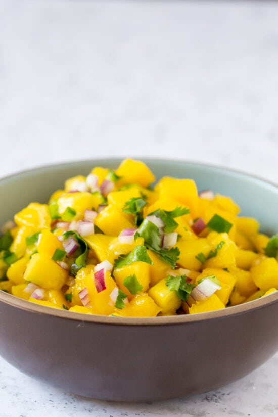 mango salsa in a brown bowl