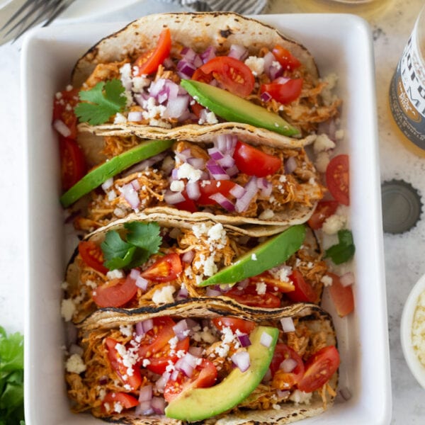 chicken tacos in a white bowl