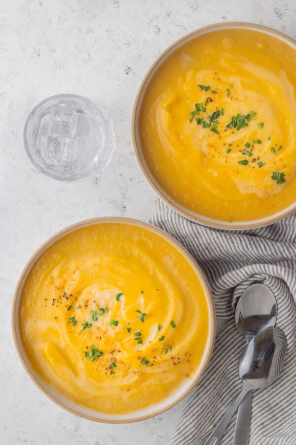two bowls of butternut soup