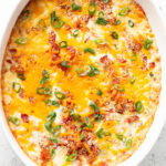 overhead view of jalapeno popper dip in a white dish